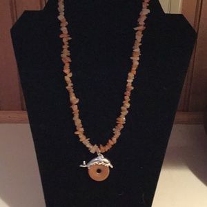 Handcrafted agate necklace with dolphin bail.